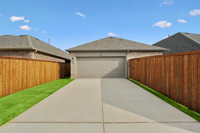 a front view of a house with garage