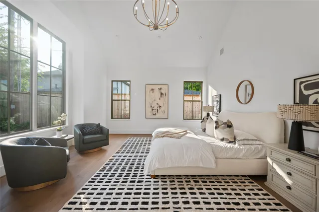 a bedroom with furniture and a window