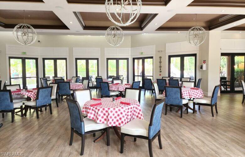 9076 Rialto Street, Unit 6204 Naples, FL 34113 - Photo 41 of 50 The amenities center with spacious dining area featuring multiple sets of French doors, and coffered ceilings.