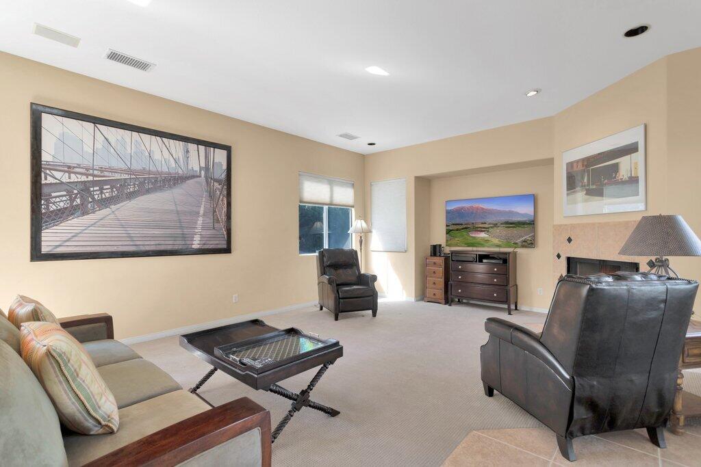 8 MacBeth Court Rancho Mirage, CA 92270 - Photo 16 of 46 a living room with furniture and a flat screen tv