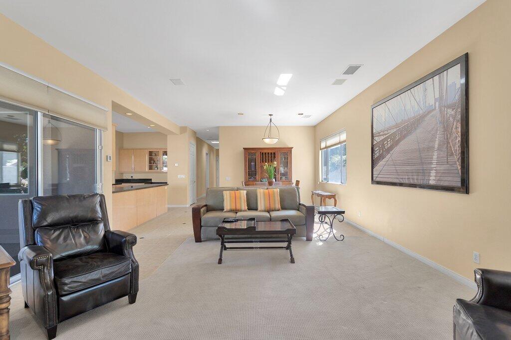 8 MacBeth Court Rancho Mirage, CA 92270 - Photo 17 of 46 a living room with furniture and a large window