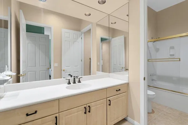 a bathroom with a sink double vanity and a mirror