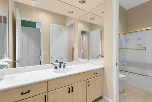 a bathroom with a sink double vanity and a mirror