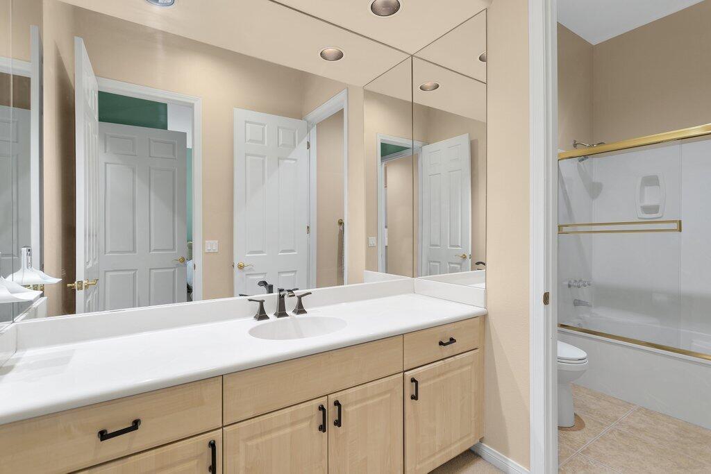 8 MacBeth Court Rancho Mirage, CA 92270 - Photo 27 of 46 a bathroom with a sink double vanity and a mirror