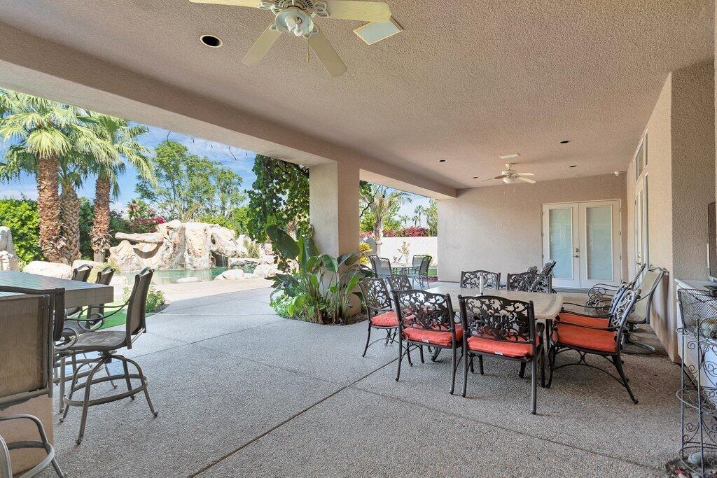 8 MacBeth Court Rancho Mirage, CA 92270 - Photo 29 of 46 a view of a dining room with furniture window and outside view