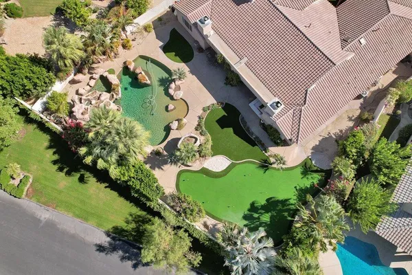 an aerial view of residential house with outdoor space