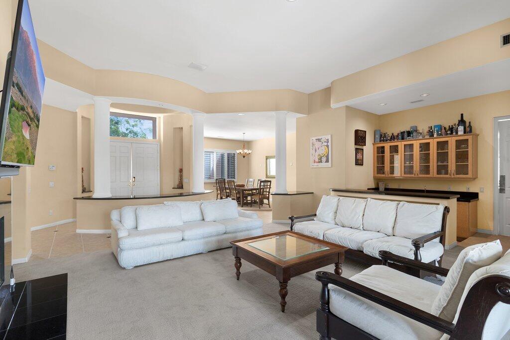 8 MacBeth Court Rancho Mirage, CA 92270 - Photo 7 of 46 a living room with furniture and a wooden floor