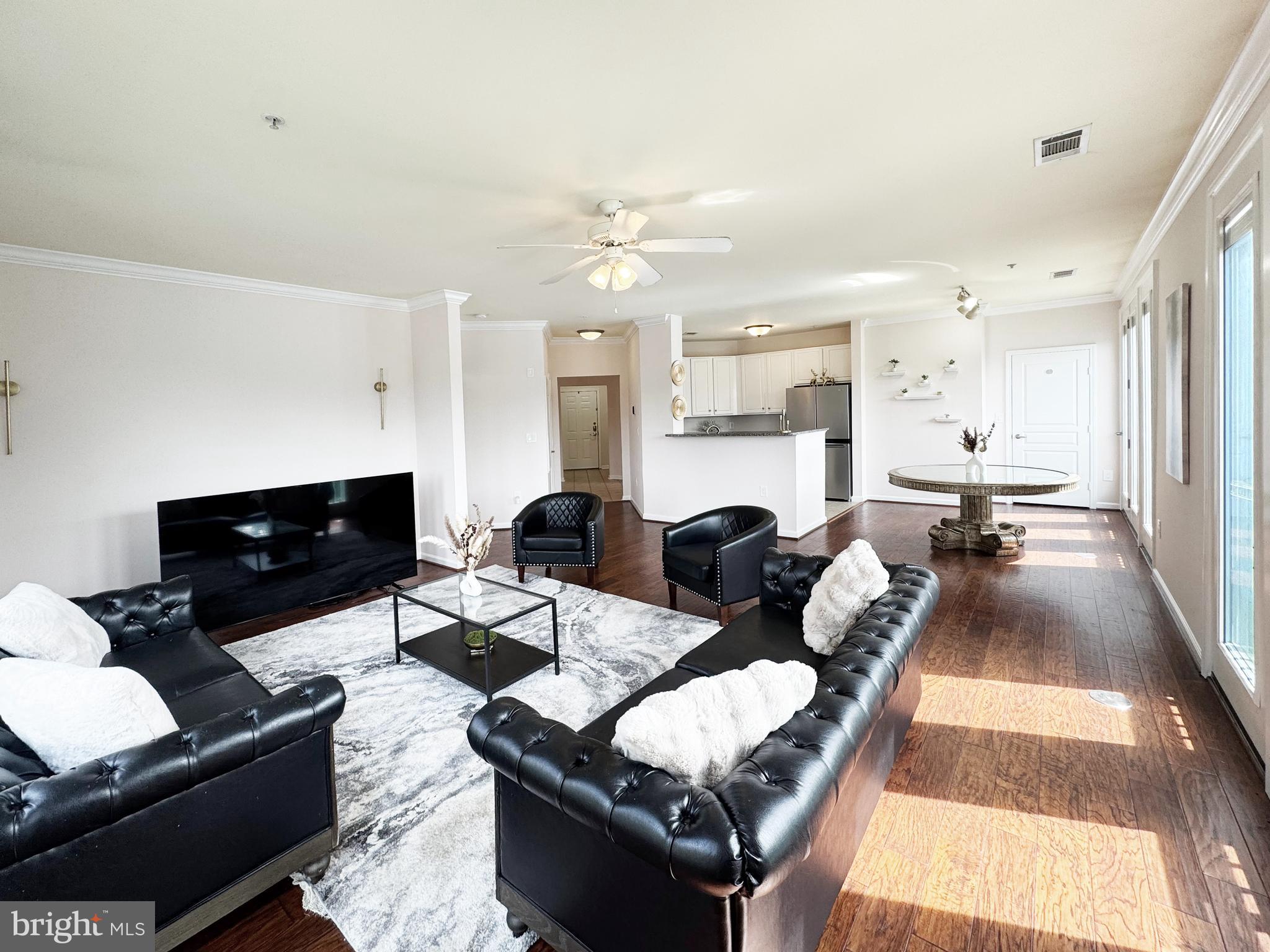 12001 Market Street, Unit 124 Reston, VA 20190 - Photo 4 of 42 Sun-Filled Family Room