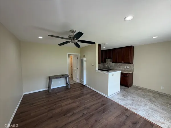 a kitchen with a refrigerator and a sink