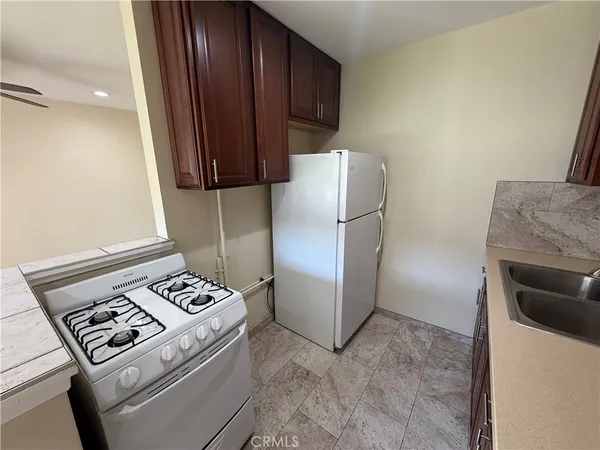 a kitchen with a stove a refrigerator and a stove