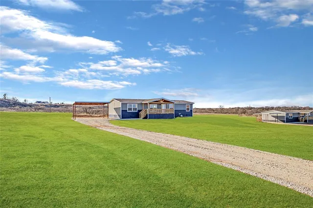 a view of a house with a big yard