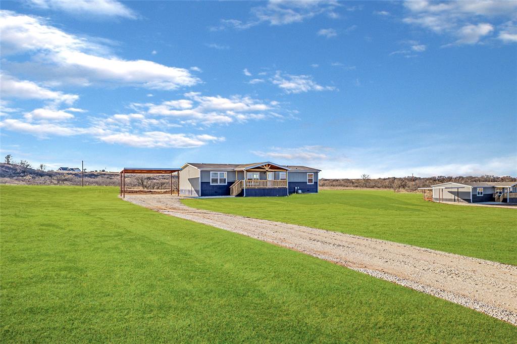 a view of a house with a big yard