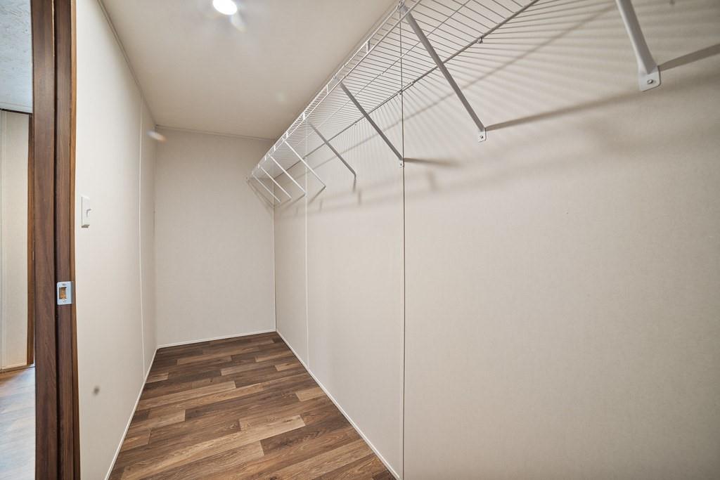 1023 Hopewell Road Bowie, TX 76230 - Photo 24 of 28 a view of a hallway with wooden floor and entryway