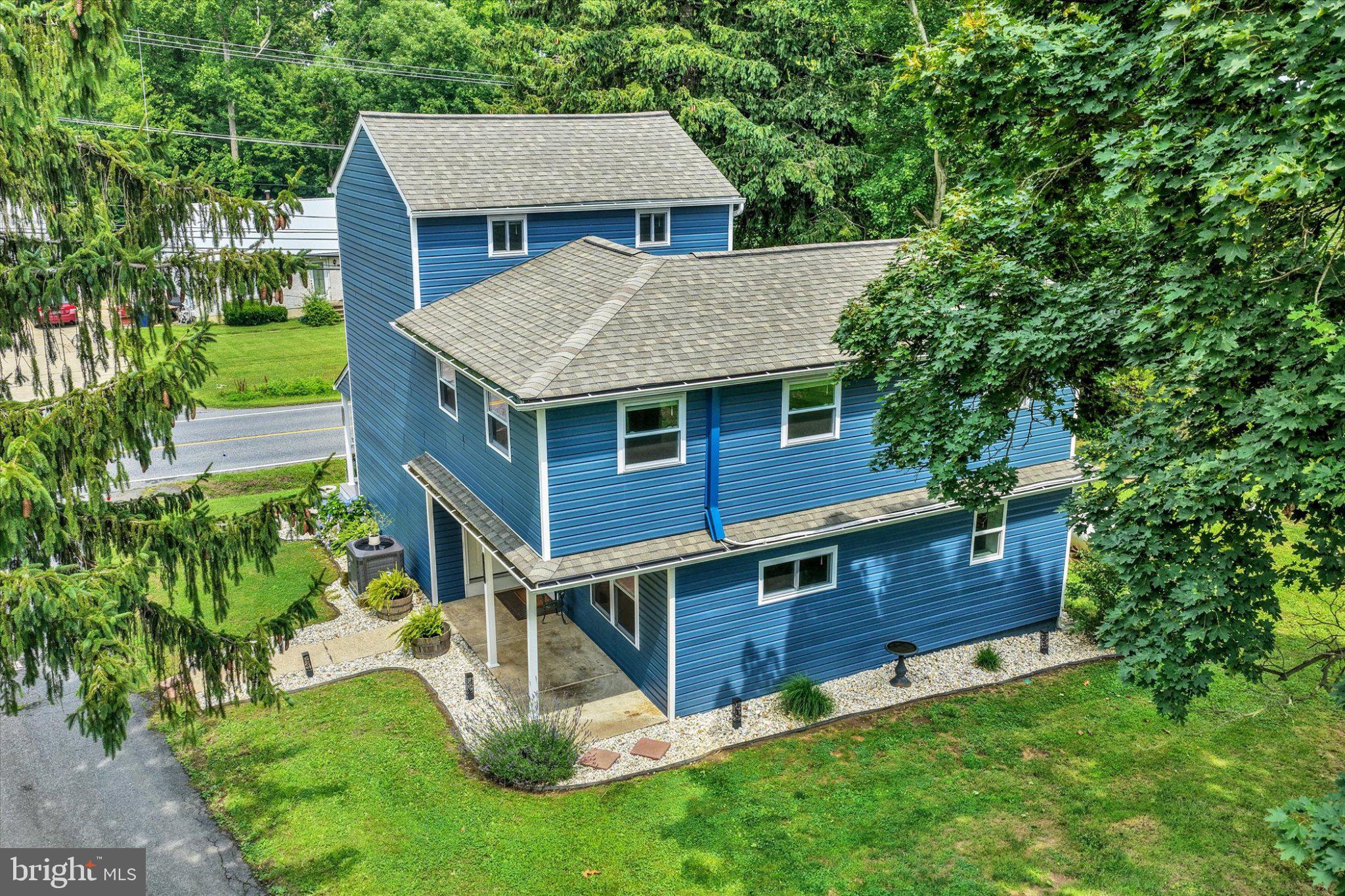 1847 Blue Ball Road Elkton, MD 21921 - Photo 40 of 45 Charming blue home nestled in greenery.