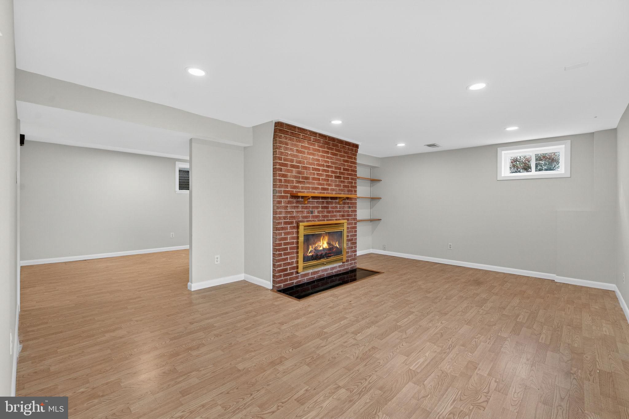 7507 Murillo Street Springfield, VA 22151 - Photo 11 of 44 a view of an empty room with a fireplace