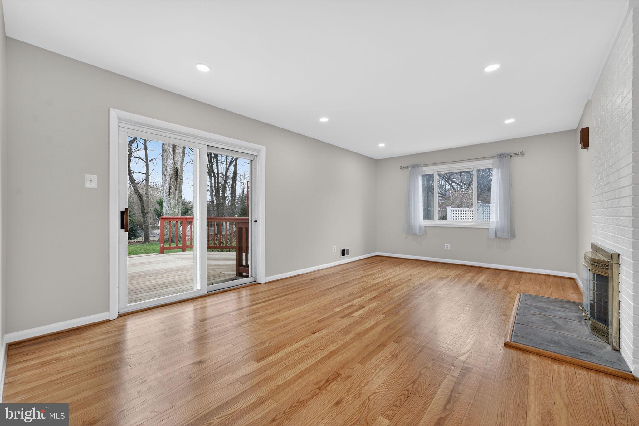7507 Murillo Street Springfield, VA 22151 - Photo 16 of 44 a view of an empty room with wooden floor and a window