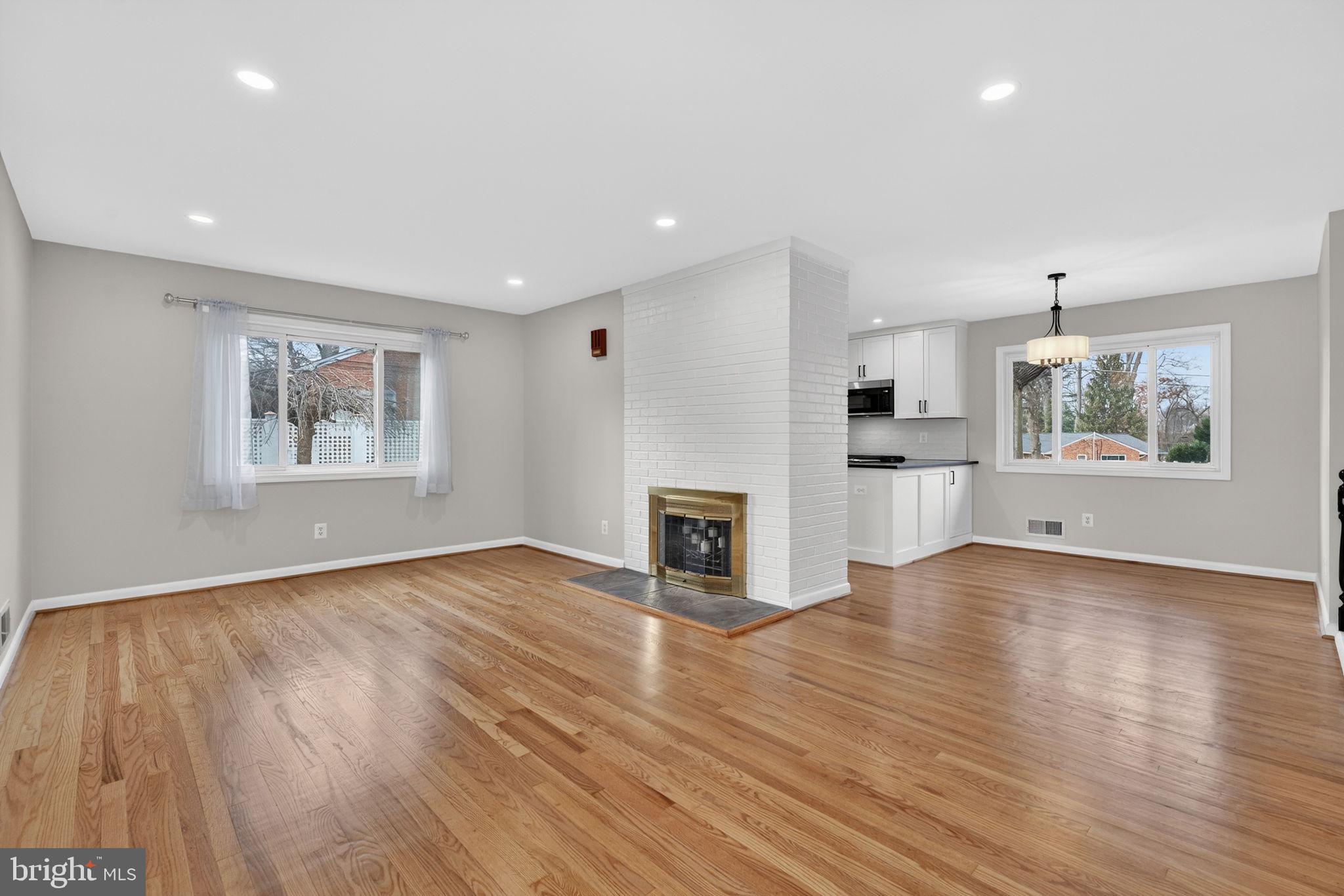 7507 Murillo Street Springfield, VA 22151 - Photo 17 of 44 a view of empty room with wooden floor and fireplace