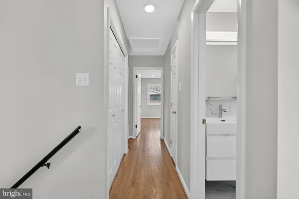 a kitchen with stainless steel appliances granite countertop a sink stove and wooden floor