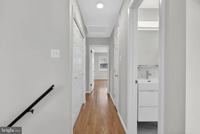 a kitchen with stainless steel appliances granite countertop a sink stove and wooden floor