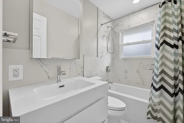 a kitchen with stainless steel appliances refrigerator and cabinets