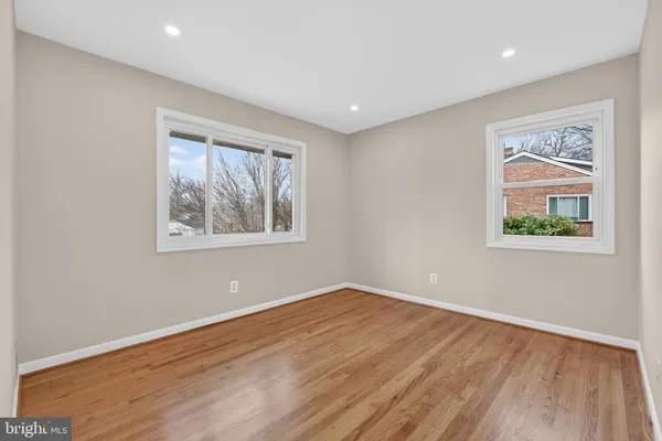 a view of an empty room and wooden floor