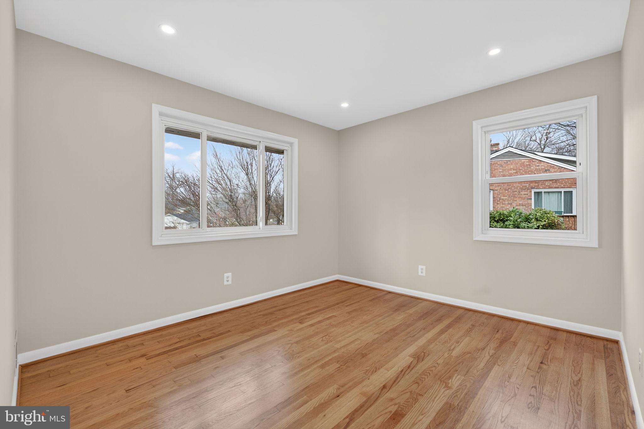 7507 Murillo Street Springfield, VA 22151 - Photo 31 of 44 a view of empty room with wooden floor and window