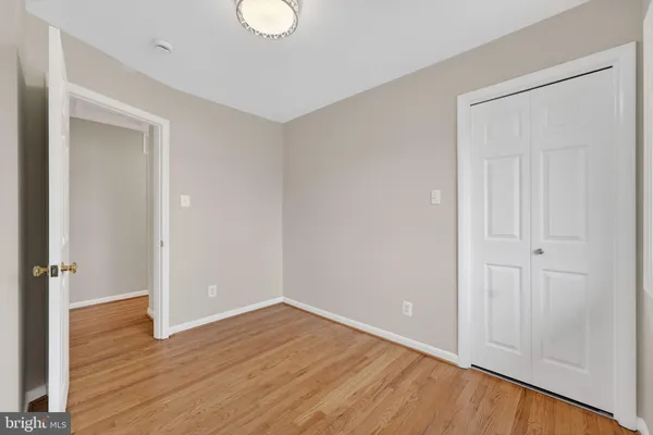 a view of room with wooden floor