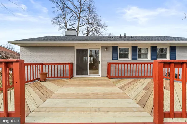 a view of street with wooden fence