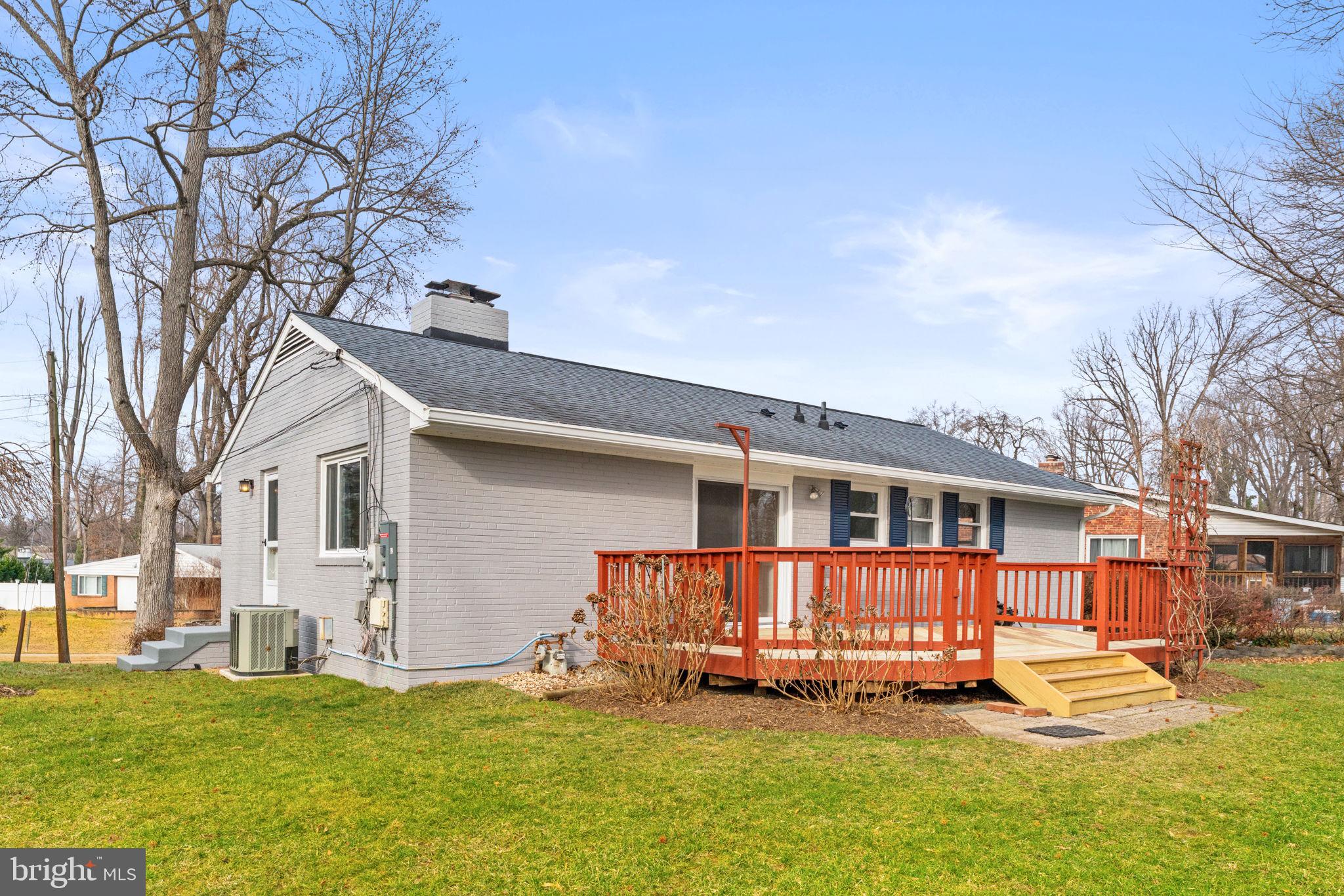7507 Murillo Street Springfield, VA 22151 - Photo 38 of 44 a front view of a house with a yard and trees