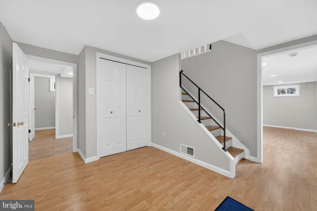 a view of an entryway with wooden floor
