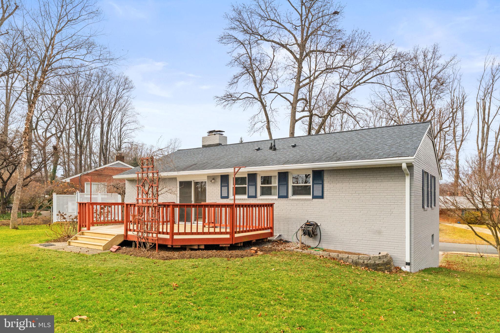 7507 Murillo Street Springfield, VA 22151 - Photo 39 of 44 a front view of a house with a yard table and chairs