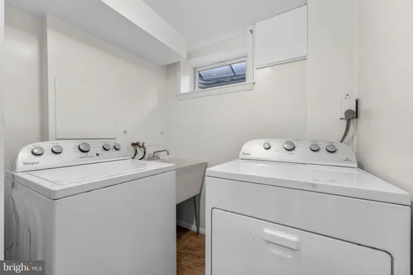 a white toilet sitting next to a bathroom sink