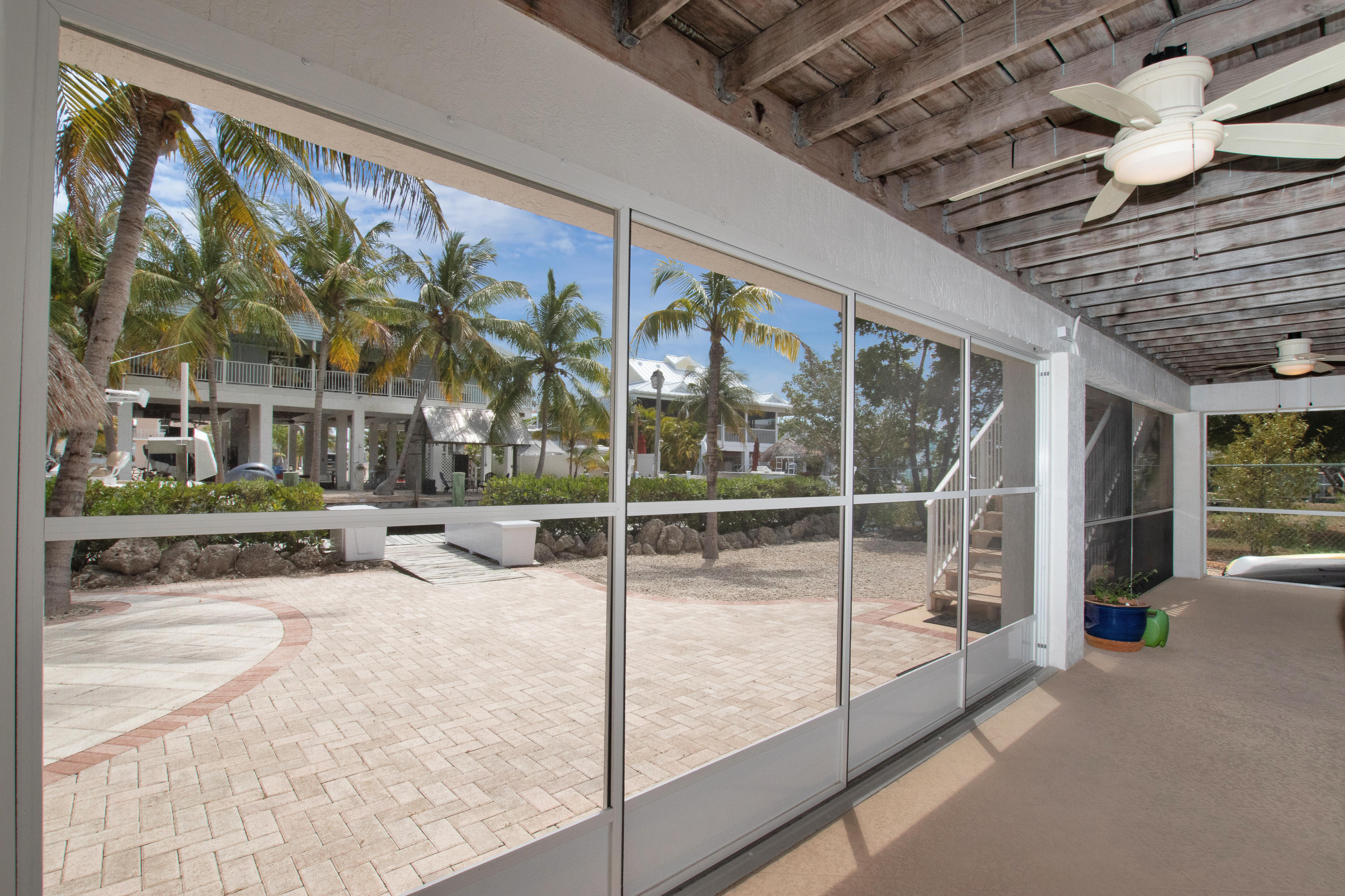 28564 Captain Kidd Road Summerland Key, FL 33042 - Photo 46 of 55 Downstairs screened area & back yard