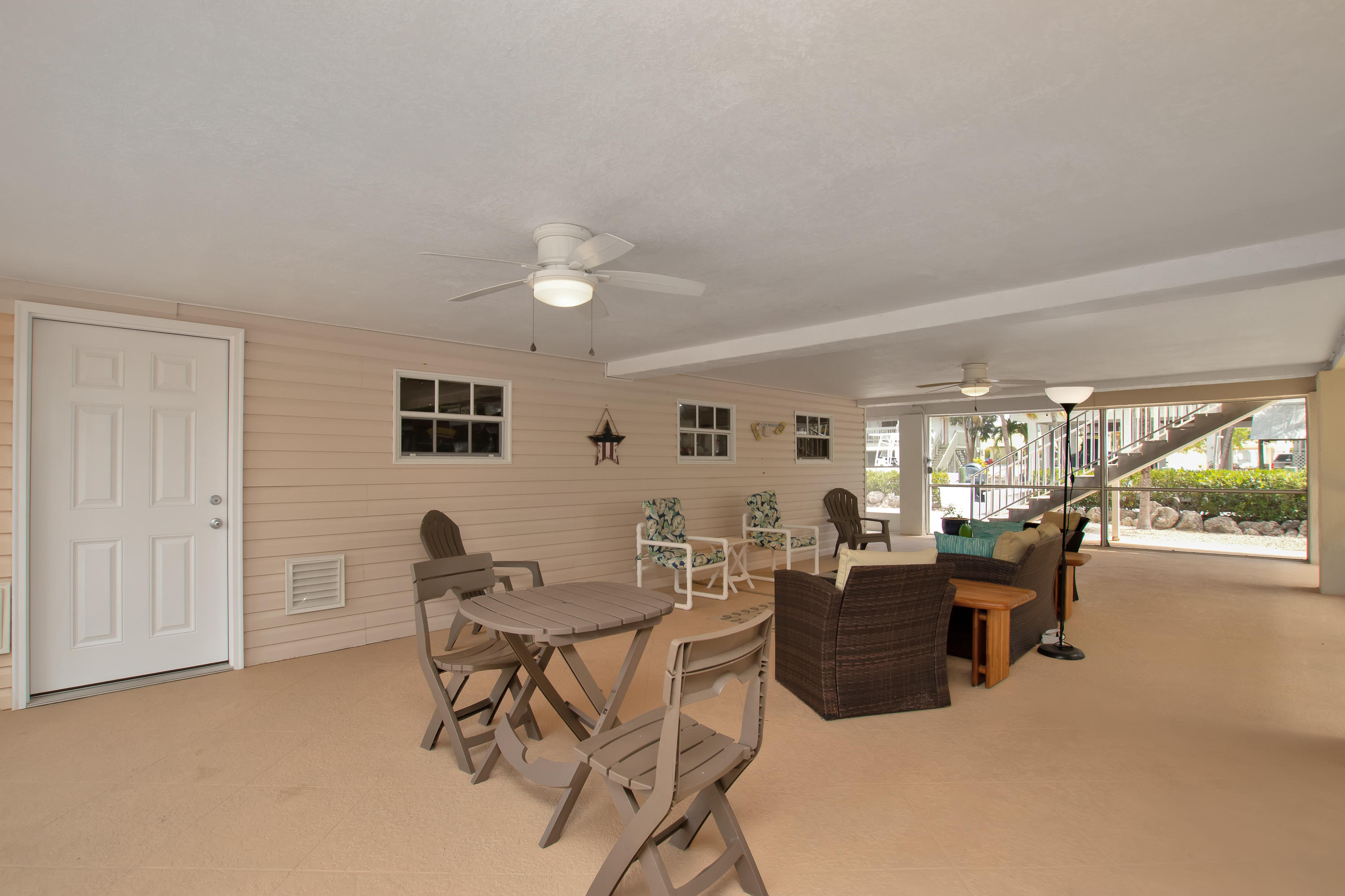 28564 Captain Kidd Road Summerland Key, FL 33042 - Photo 49 of 55 Downstairs screened sitting area 2