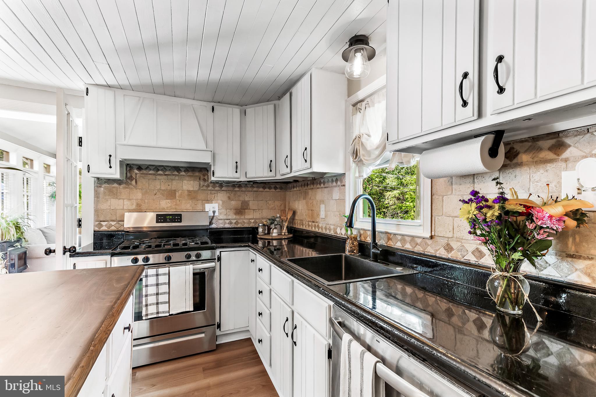 11914 Jericho Road Kingsville, MD 21087 - Photo 20 of 71 a kitchen with stainless steel appliances granite countertop a sink a stove and a white cabinets