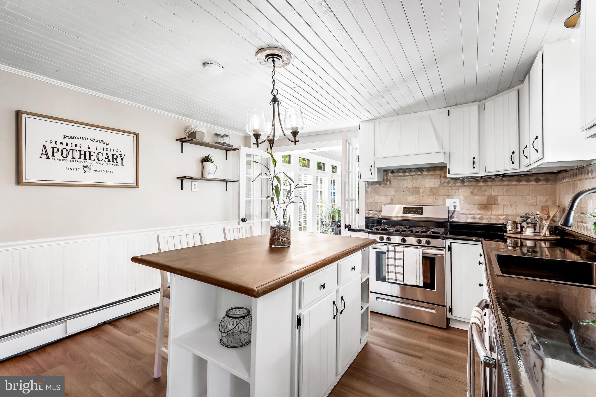 11914 Jericho Road Kingsville, MD 21087 - Photo 21 of 71 a kitchen with stainless steel appliances granite countertop a sink a stove and a refrigerator