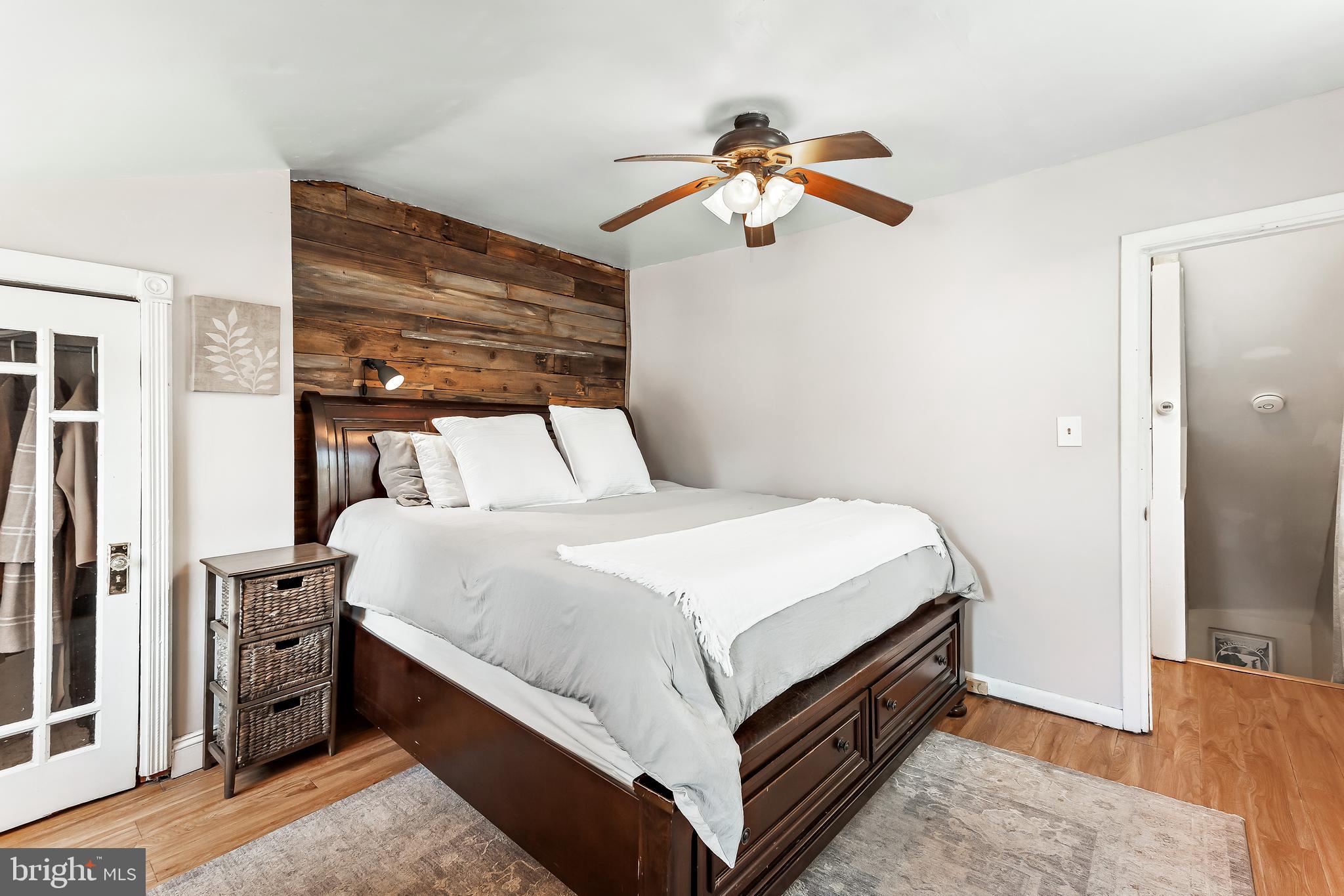 11914 Jericho Road Kingsville, MD 21087 - Photo 27 of 71 a bedroom with a bed and a chandelier