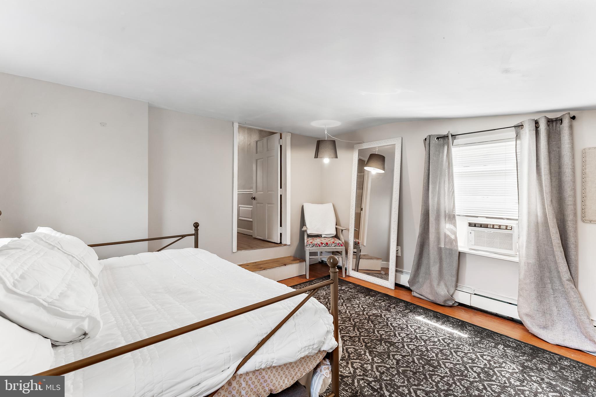 11914 Jericho Road Kingsville, MD 21087 - Photo 34 of 71 a bedroom with a bed and wooden floor