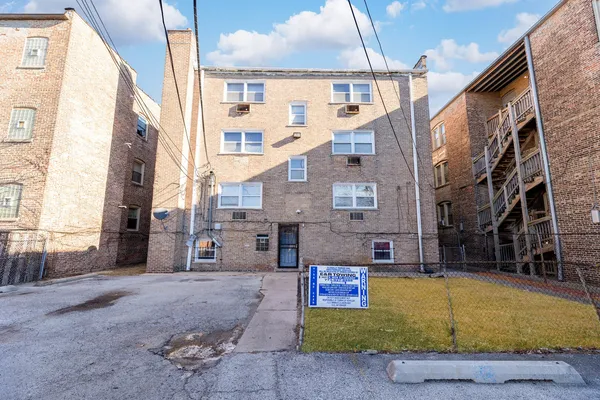a view of a building with a swimming pool