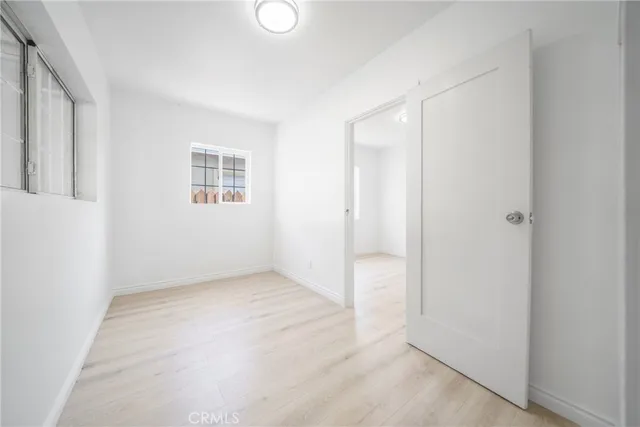 a view of an empty room with a sliding door