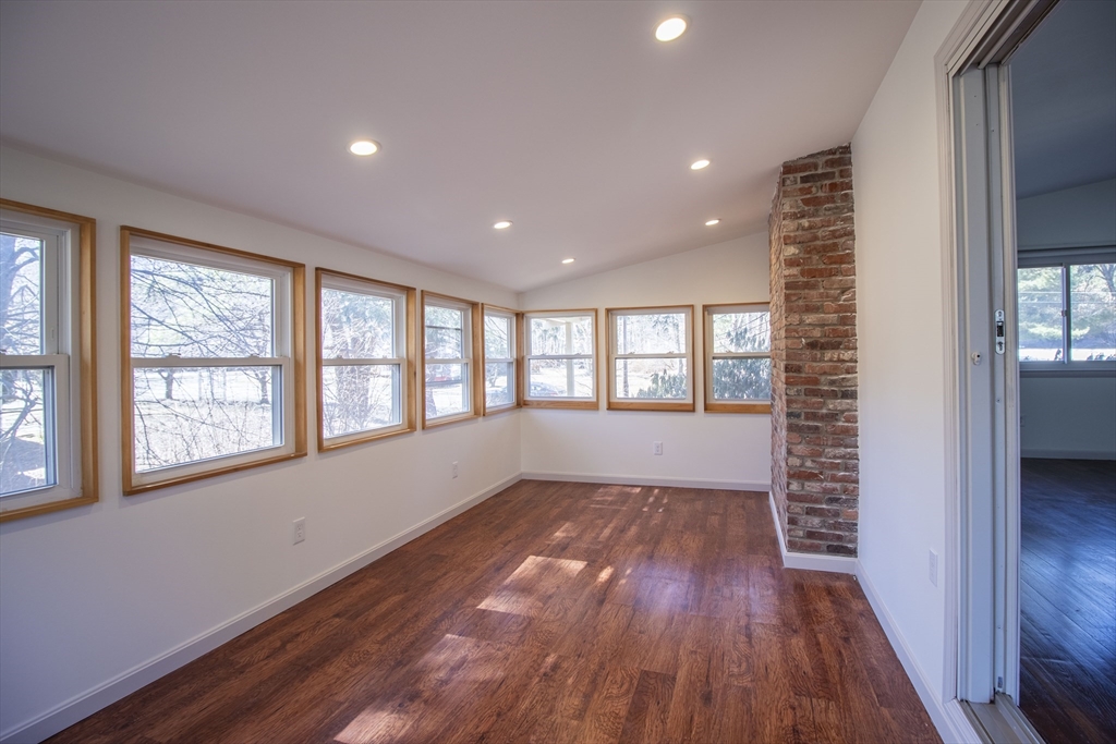 12 Johnson Road Sharon, MA 02067 - Photo 12 of 14 a view of an empty room with glass door and wooden floor