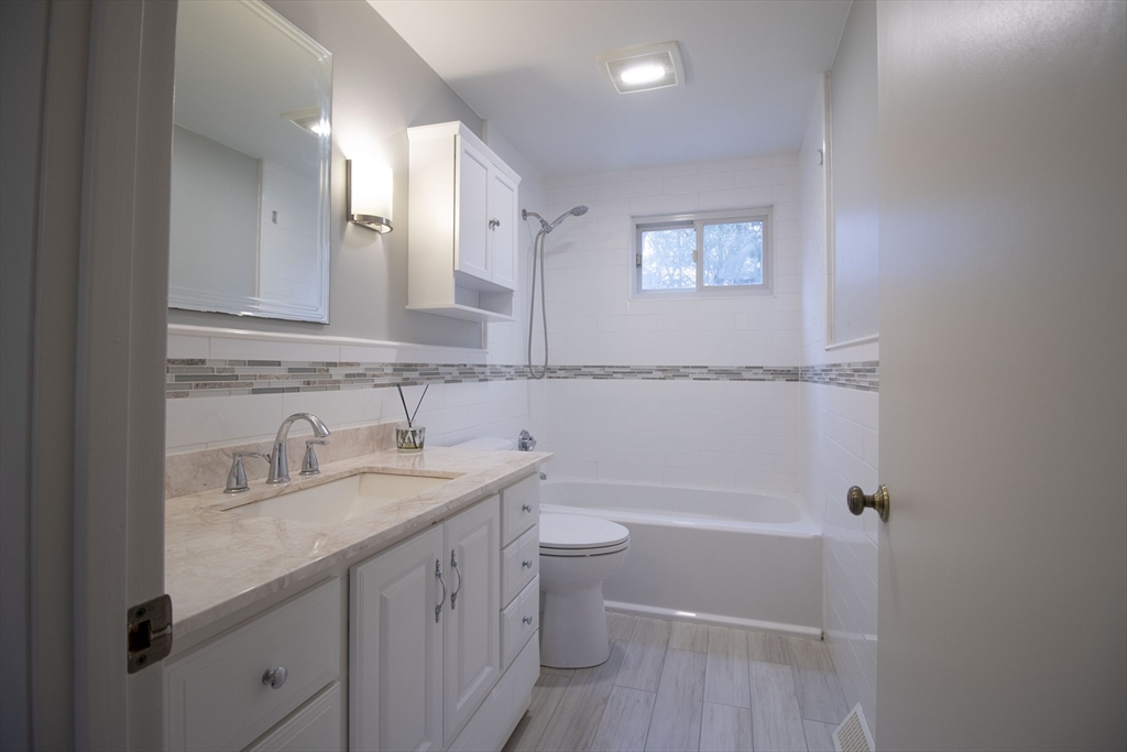 12 Johnson Road Sharon, MA 02067 - Photo 6 of 14 a bathroom with a granite countertop sink toilet and shower