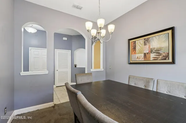 a view of a room with wooden floor and large window