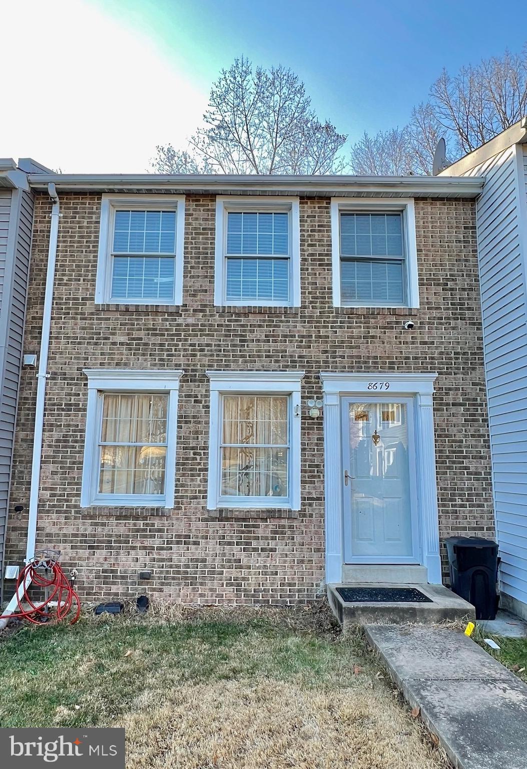 8679 Hickory Ridge Court Springfield, VA 22153 - Photo 19 of 23 a front view of a house with garden