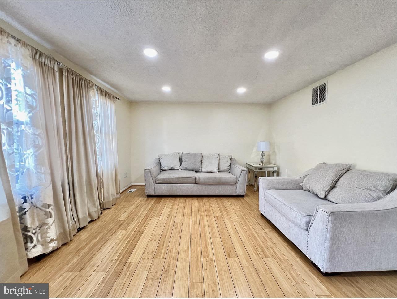 8679 Hickory Ridge Court Springfield, VA 22153 - Photo 2 of 23 a living room with furniture and a couch