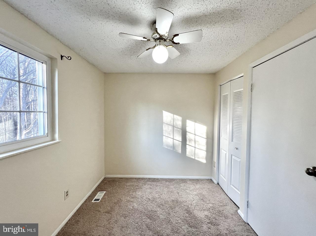 8679 Hickory Ridge Court Springfield, VA 22153 - Photo 8 of 23 a view of an empty room with a window