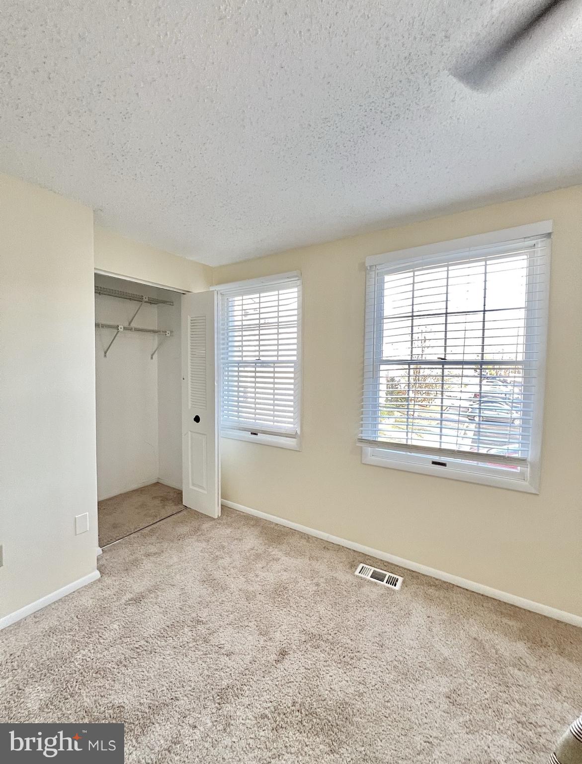 8679 Hickory Ridge Court Springfield, VA 22153 - Photo 9 of 23 an empty room with windows