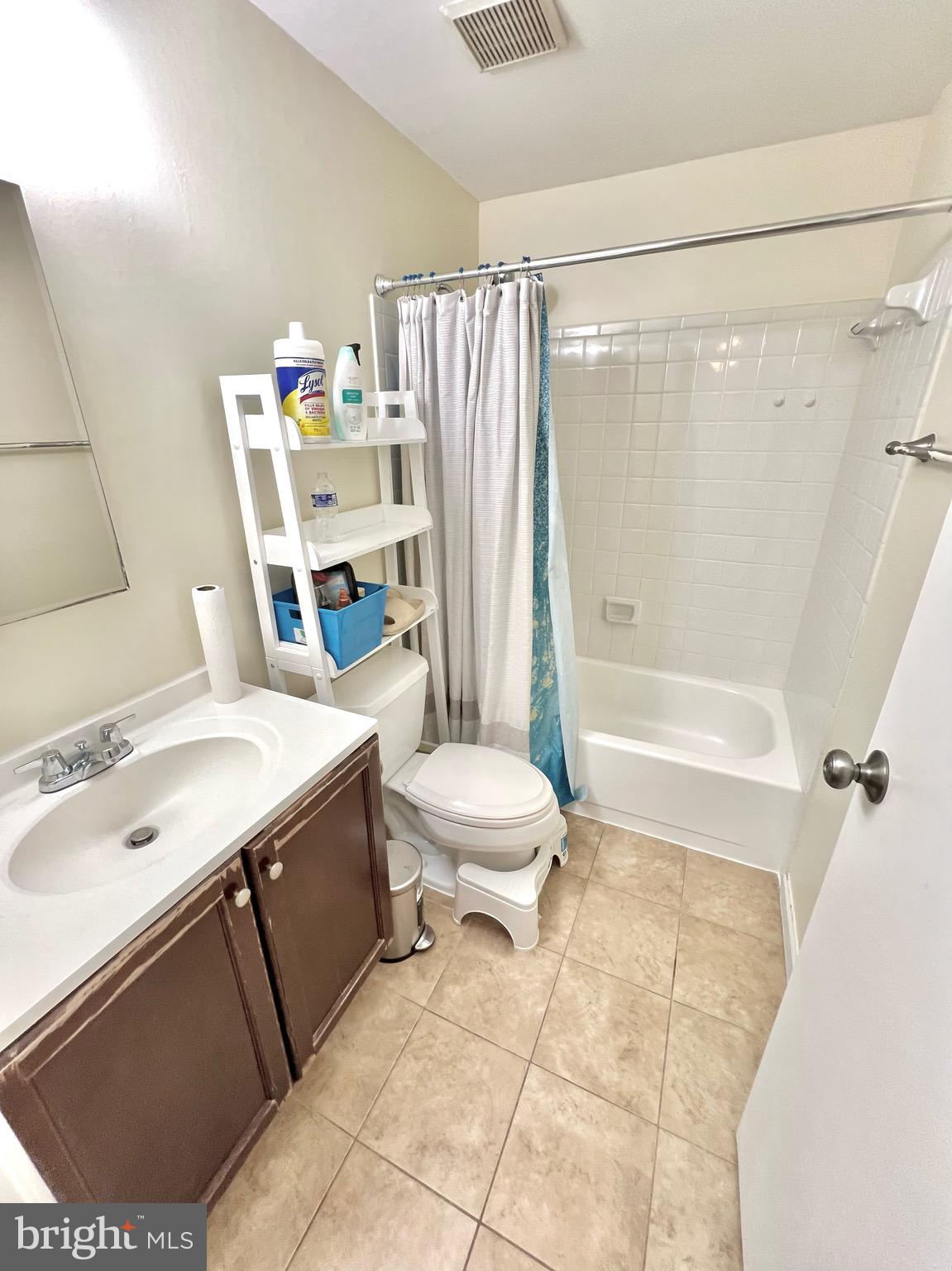 8679 Hickory Ridge Court Springfield, VA 22153 - Photo 10 of 23 a bathroom with a sink a toilet and shower