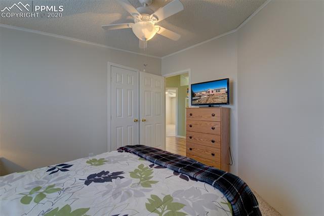 8050 Edison Road Yoder, CO 80864 - Photo 26 of 34 Bedroom with view of closet door & into the hall