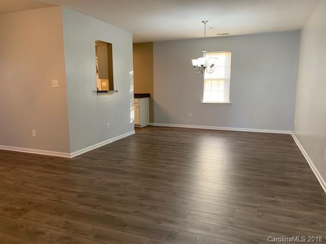 534 Funderburk Road Wingate, NC 28174 - Photo 3 of 11 an empty room with wooden floor and windows